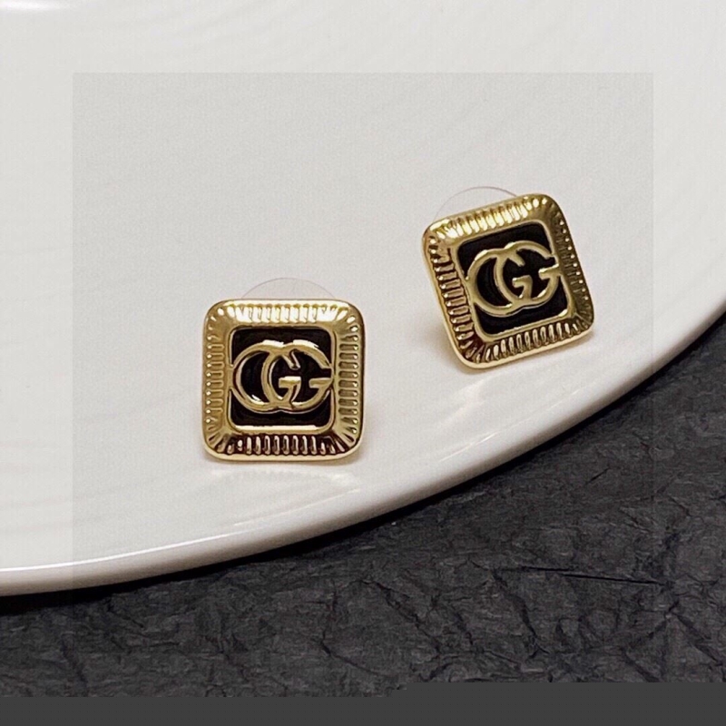 G*u*i earrings